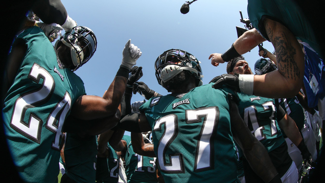 The Philadelphia Eagles, in the team’s modern midnight green uniforms
